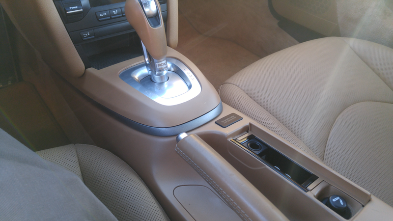 Under radio cubby: good for wallet or cell phone